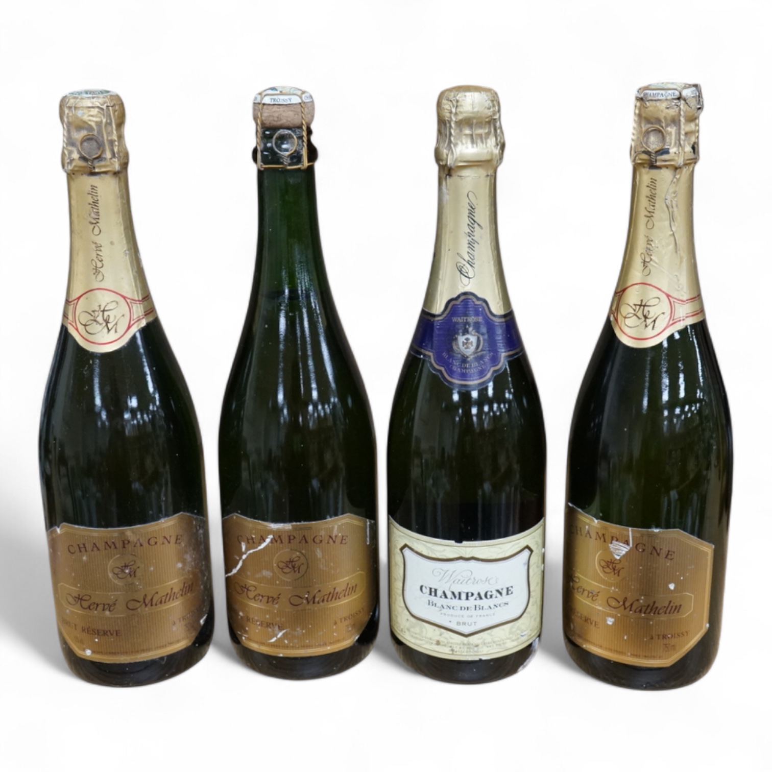 Four bottles of Champagne to include three bottles of Herve Mathelin. Condition - fair